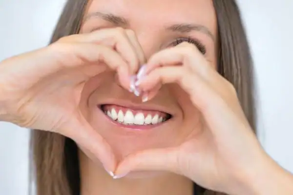 Woman happy with white smile after Blue Light Teeth Whitening Aldershot