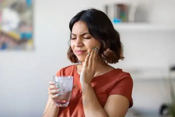 Woman experiencing sensitive teeth Aldershot